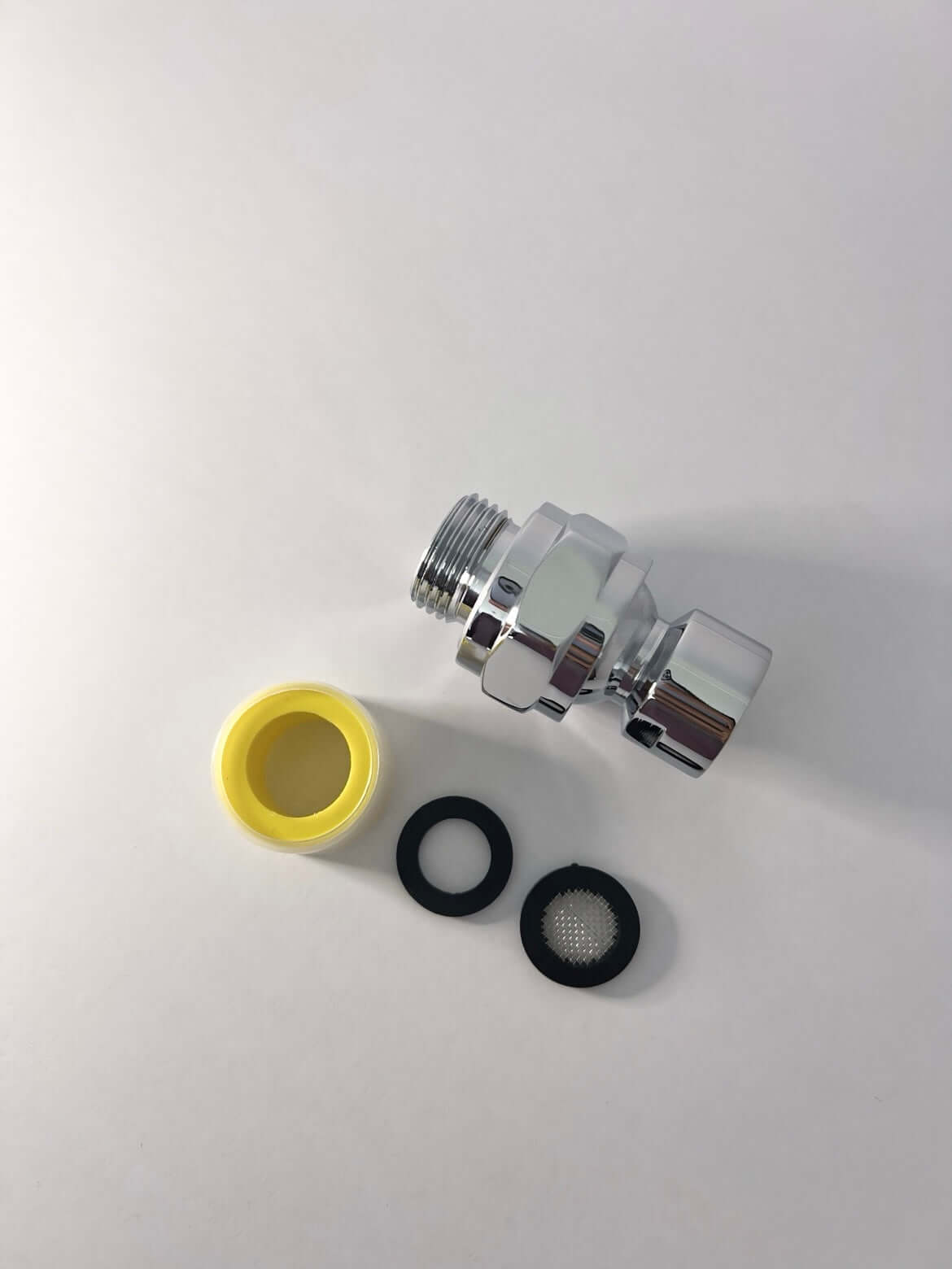 Ngilla Flow swivel adapter set with yellow tape and black rubber washers on white background